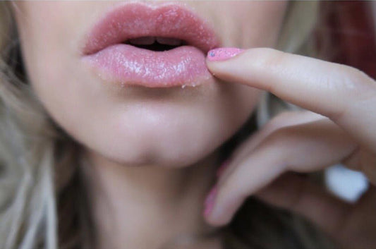 Girl using lip scrub 